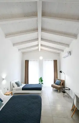 Letto o letti in una camera di DoMe Affittacamere