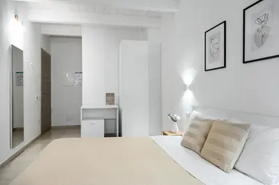 Letto o letti in una camera di DoMe Affittacamere