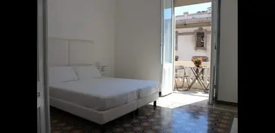 Letto o letti in una camera di Cagliari d'Amare Via Roma