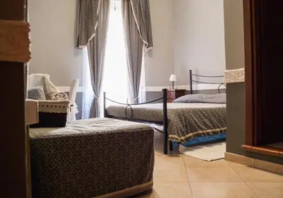 Letto o letti in una camera di B&B Su Maimoni