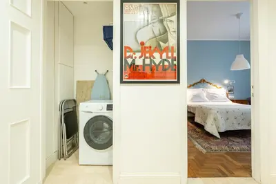 Letto o letti in una camera di Appartamento luminoso di design in centro