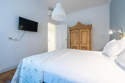 Letto o letti in una camera di Appartamento luminoso di design in centro