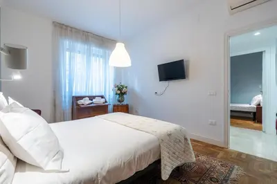 Letto o letti in una camera di Appartamento luminoso di design in centro