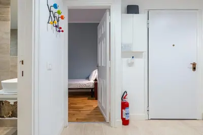 Letto o letti in una camera di Appartamento luminoso di design in centro