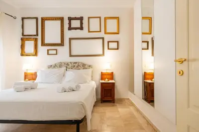 Letto o letti in una camera di Panorama di mare suite via Cima Cagliari Centro