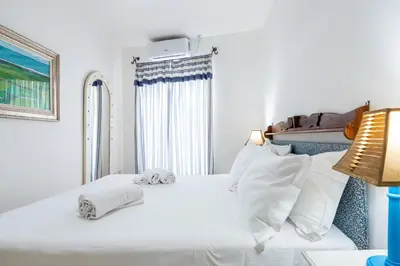 Letto o letti in una camera di Appartamento Cagliari centro con vista sul porto
