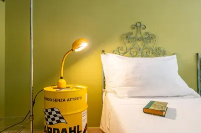 Letto o letti in una camera di Appartamento Cagliari centro con vista sul porto