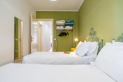 Letto o letti in una camera di Appartamento Cagliari centro con vista sul porto