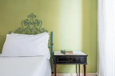 Letto o letti in una camera di Appartamento Cagliari centro con vista sul porto
