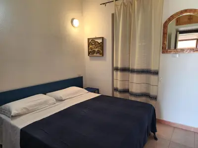 Letto o letti in una camera di Villetta Sunrise 47