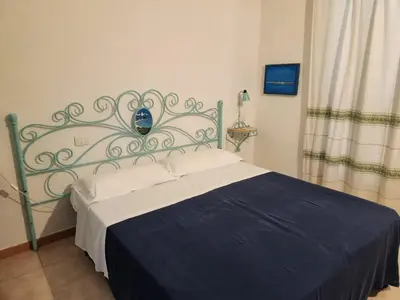 Letto o letti in una camera di Villetta Sunrise 47