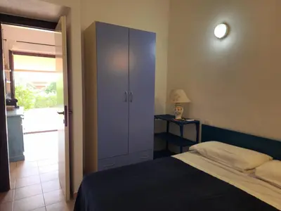 Letto o letti in una camera di Villetta Sunrise 47