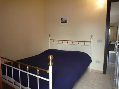 Letto o letti in una camera di Villetta Sunrise 45