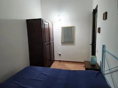 Letto o letti in una camera di Villetta Sunrise 77