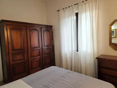 Letto o letti in una camera di Villetta Sunrise 18