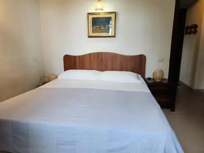 Letto o letti in una camera di Villetta Sunrise 18