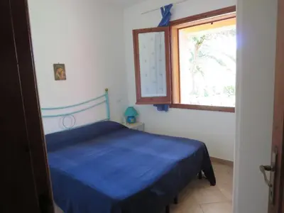 Letto o letti in una camera di Villetta Sunrise 6