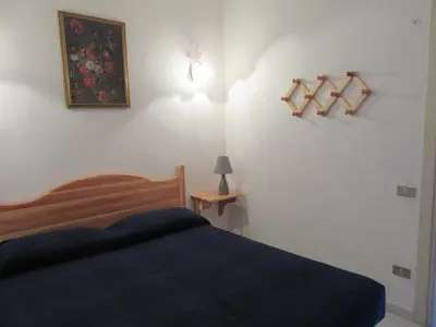 Letto o letti in una camera di Villetta Sunrise 44