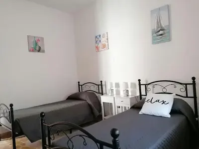 Letto o letti in una camera di Mistral house - alloggio sud ovest della Sardegna