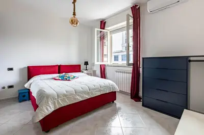 Letto o letti in una camera di GuestHost - Cagliari Flat near the Station with Balcony!
