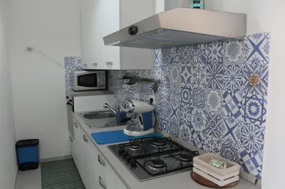 Cucina o angolo cottura di Casa Forgia ampia casa vacanze Villasimius