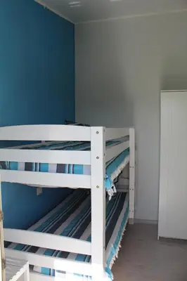 Letto o letti a castello in una camera di Casa Forgia ampia casa vacanze Villasimius