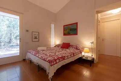 Letto o letti in una camera di Villa Margherita Sardegna 250 m dalla spiaggia