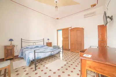 Letto o letti in una camera di S'Apprigu B&B