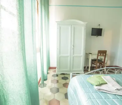 Letto o letti in una camera di S'Apprigu B&B
