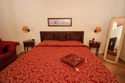 Letto o letti in una camera di B&B LA POSADA