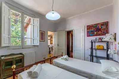 Letto o letti in una camera di Lux Historic Villa Giardini, with private Pool SouthSardiniaHolidays