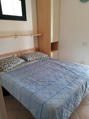 Letto o letti in una camera di Villetta Mari Pintau