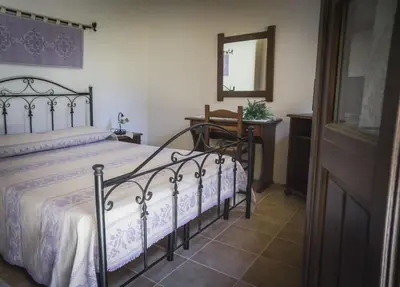Letto o letti in una camera di Albergo Diffuso Il Mandorlo
