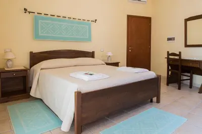 Letto o letti in una camera di Albergo Diffuso Il Mandorlo