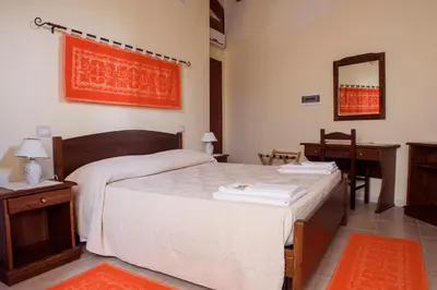 Letto o letti in una camera di Albergo Diffuso Il Mandorlo