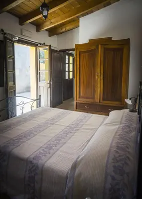 Letto o letti in una camera di Albergo Diffuso Il Mandorlo