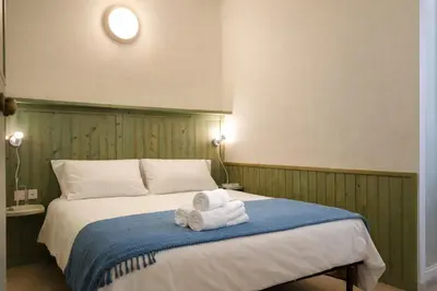 Letto o letti in una camera di la casetta dei pescatori PORTO PINO