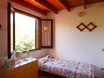 Letto o letti in una camera di Apartment in Costa Rei near White Sandy Beaches