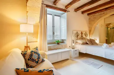Letto o letti in una camera di GH Flat Studio S.Martino