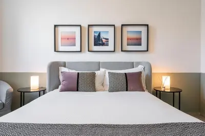 Letto o letti in una camera di La Plaia Suites