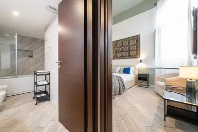 Letto o letti in una camera di La Plaia Suites