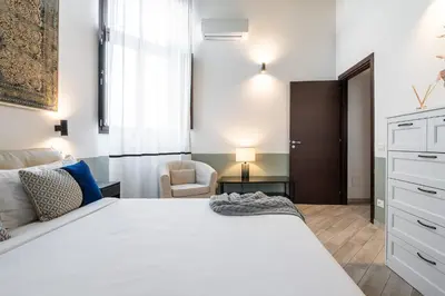 Letto o letti in una camera di La Plaia Suites