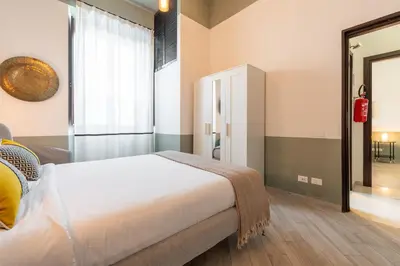 Letto o letti in una camera di La Plaia Suites