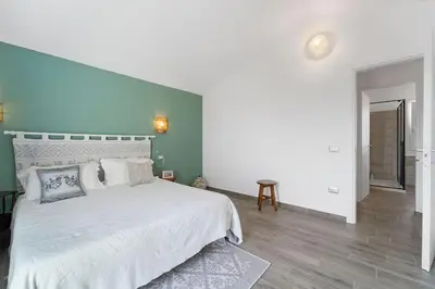 Letto o letti in una camera di Aria De Domus