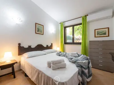 Letto o letti in una camera di Casa Anna - Steps to Costa Rei Beach