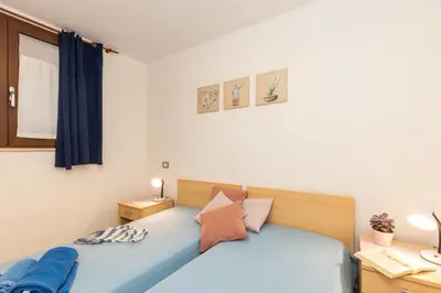 Letto o letti in una camera di VILLE MONDO a 350 metri dalla spiaggia