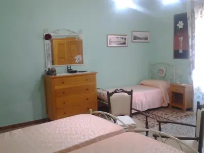 Letto o letti in una camera di B&B Su Semucu