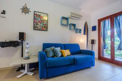 Area soggiorno di Porto Pino, Garden and Pool SouthSardiniaHolidays