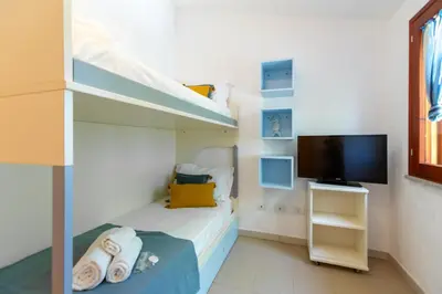 TV o dispositivi per l'intrattenimento presso Porto Pino, Garden and Pool SouthSardiniaHolidays