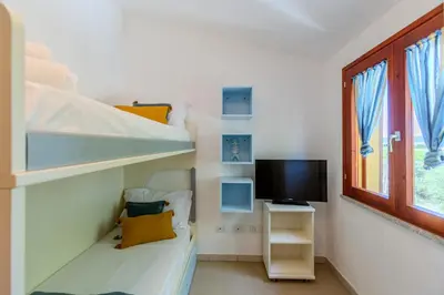 TV o dispositivi per l'intrattenimento presso Porto Pino, Garden and Pool SouthSardiniaHolidays